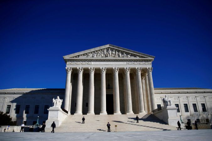 FILE PHOTO: Police officers stand in front of the U.S. Supreme Court in Washington